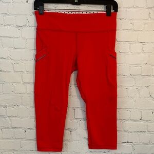 Lululemon Red Capri leggings with side pockets with reflective stripe
